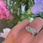 tweedehands vintage ring met edelstenen topaas roze en blauw