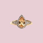 vintage ring met gele topaas peer en halo van 9 karaat goud
