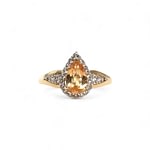 vintage ring met gele topaas peer en halo van 9k goud