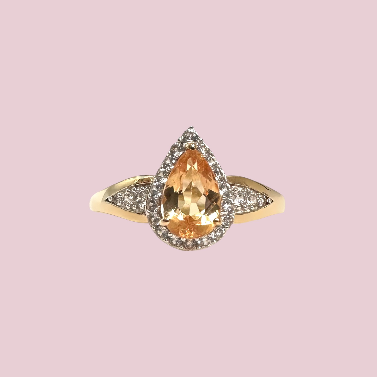 vintage ring met gele topaas peer en halo van 9 karaat goud