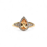 vintage ring met gele topaas peer en halo van 9k goud