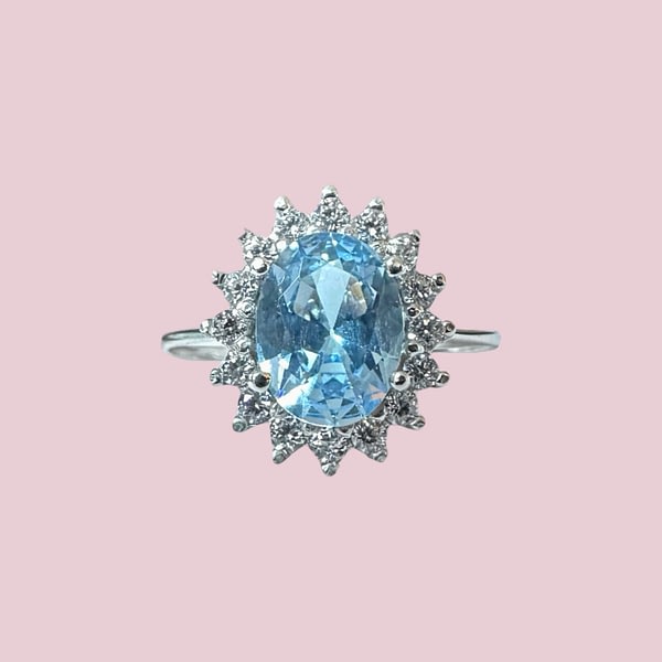 cluster ring witgoud lichtblauwe steen