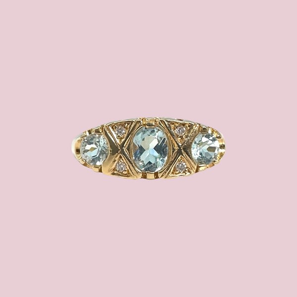 vintage trilogie ring topaas en diamant