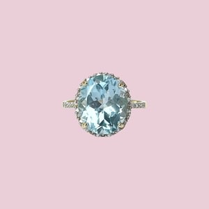 blauwe topaas ring diamant halo 10 karaat goud