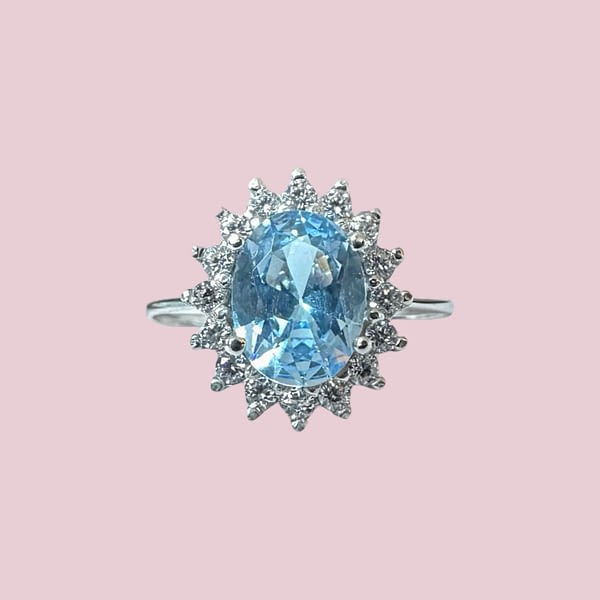 cluster ring witgoud lichtblauwe steen