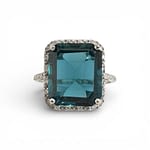 vintage london blue topaz halo ring in witgoud