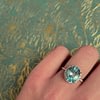 lichtblauwe saffier ring cluster diamant halo