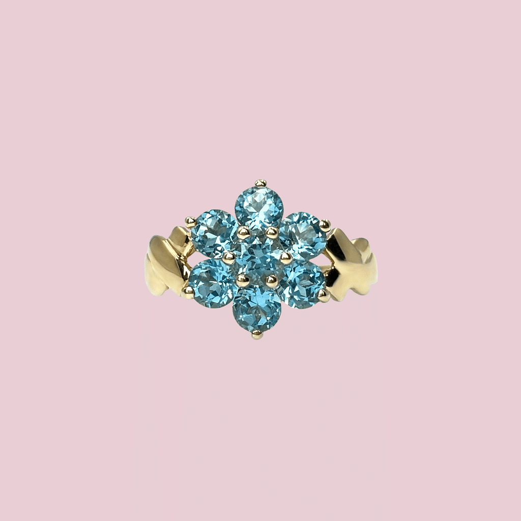 vintage ring met bloem van blauwe topaas